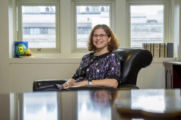 Roz Segal sitting at a desk