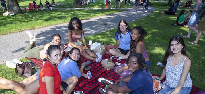 group of students having  a picnic lunch