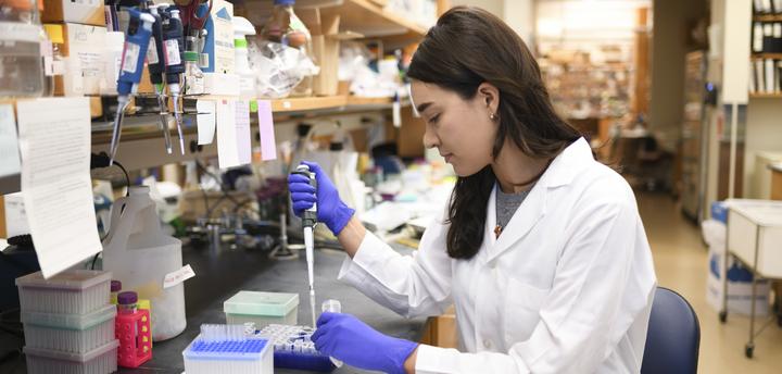 student pipetting