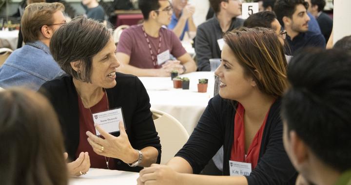 two women talking at the HILS Welcome Dinner