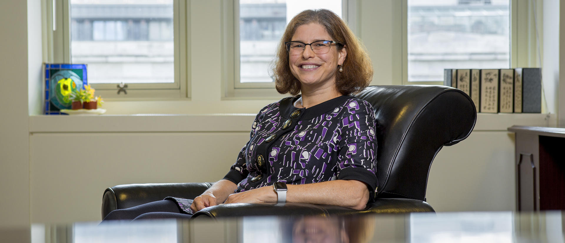 Roz Segal sitting at a desk