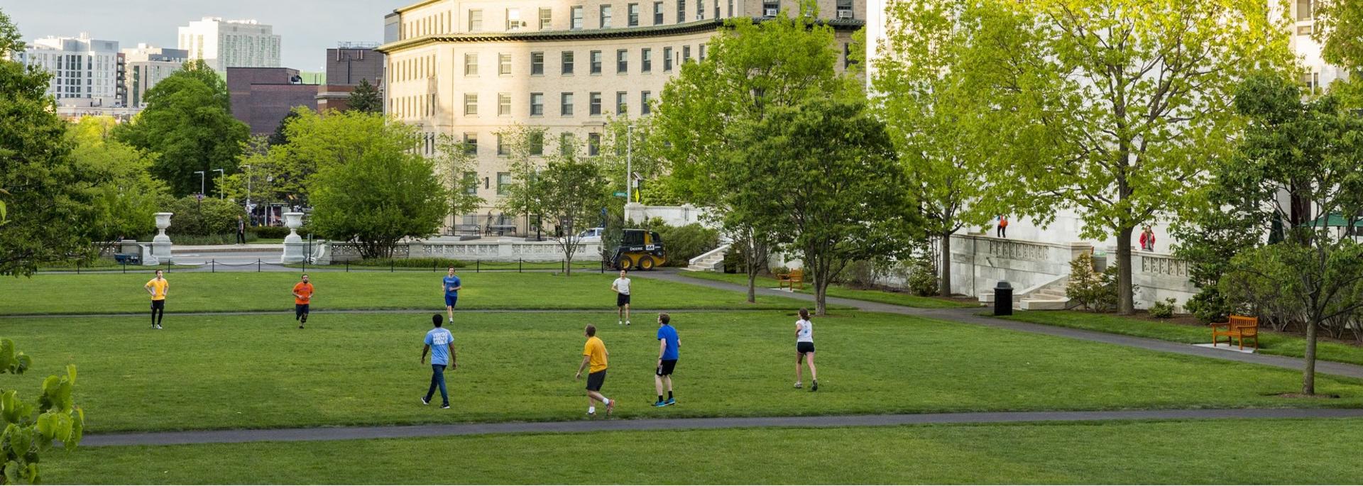students playing frisbee on the quad